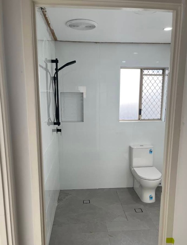 Modern bathroom with black shower fixtures