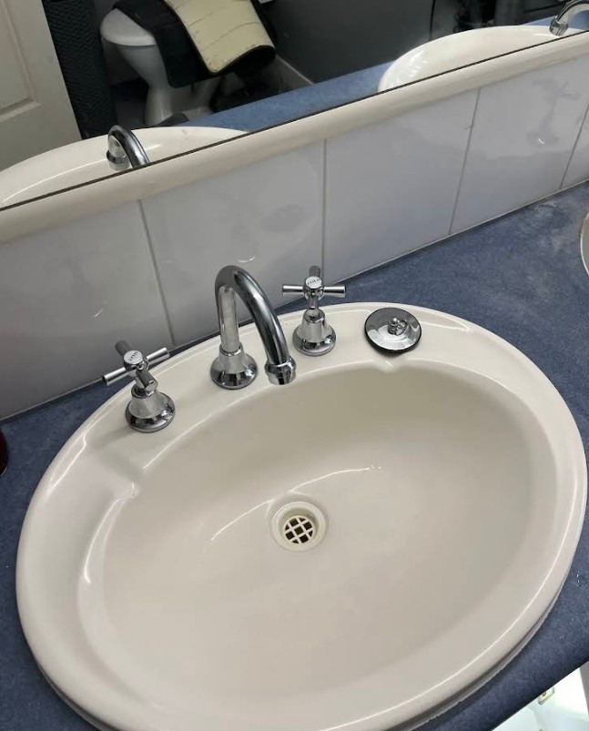 Classic bathroom basin with cross-handle taps